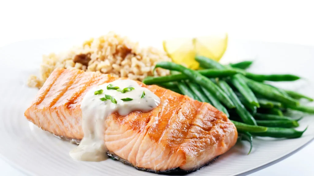 Delicious and elegant dinner for one with pan-seared salmon, creamy mushroom risotto, and vegetable stir-fry, perfect for solo dining